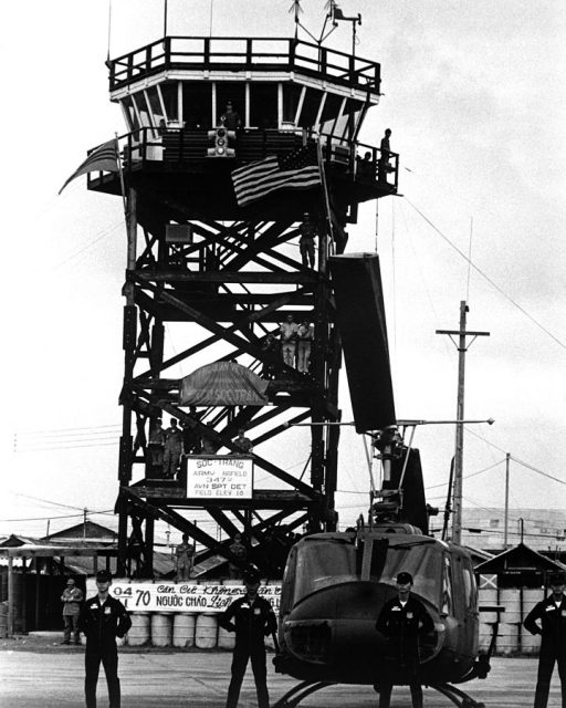 Moments before the U.S. flag was replaced by the Vietnamese flag, Vietnamese Air Force crewmen line up before one of the 62 UH-1 “Huey” helicopters turned over to them on November 4, 1970, along with command of the Soc Trang airfield.