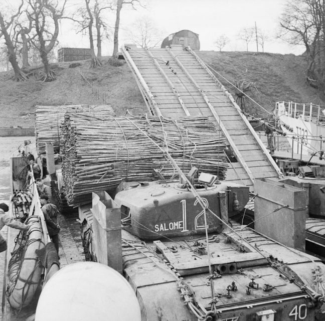 Armoured Division Churchill AVREs with fascines and Churchill bridgelayer loaded into a landing craft, Saxmundham-Ipswich area, 28 January 1944.