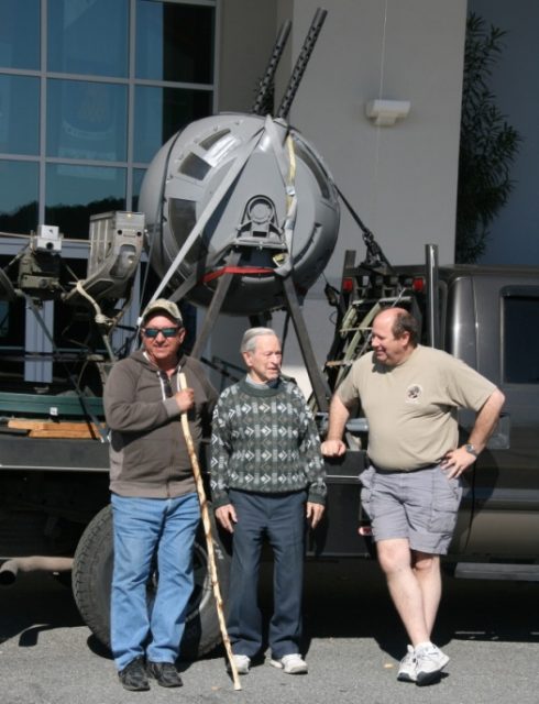 Bud Porter welcoming the City of Savannah ball turret to the NMMEAF after its cross-country trip. (Tommy Garcia and Jeff Hoopes – transport team.)