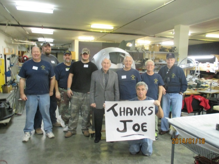 Joe Glasser with City of Savannah volunteers. The ball turret that Joe purchased for the project is in the background.