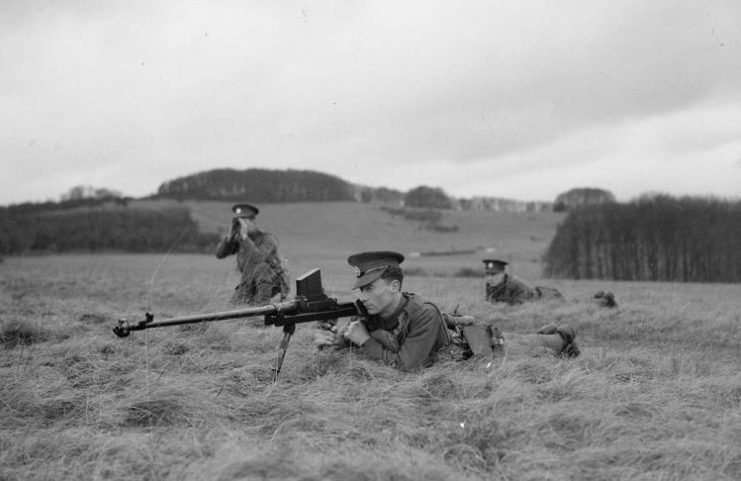 Soldier of The Rifle Brigade prepares to fire a 0.55 inch Boys Anti-tank Rifle during a military exercise, 1938.