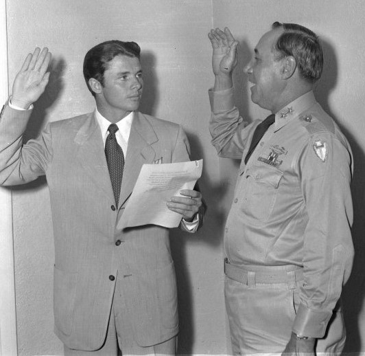 Captain Audie Murphy is sworn in to the Texas National Guard by U. S. Army Major General H. Miller Ainsworth 14 July 1950