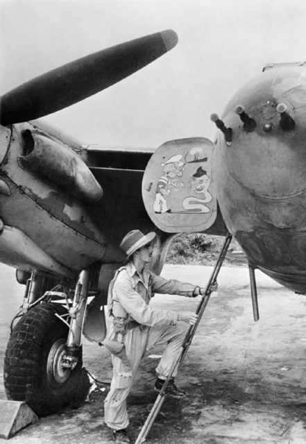 Flight Lieutenant A Torrance of Stonehouse, Lanarkshire, Scotland, a pilot serving with ‘A’ Flight, No. 27 Squadron RAF, climbs into his De Havilland Mosquito FB VI at Parashuram, India, for a sortie over Burma, March 1944.