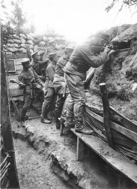 German soldiers of the 11th Reserve Hussar Regiment fighting from a trench, on the Western Front, 1916.