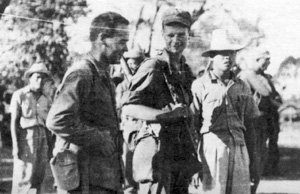 Captains Jimmy Fisher and Robert Prince and several Filipino guerrillas a few hours before the start of a raid.