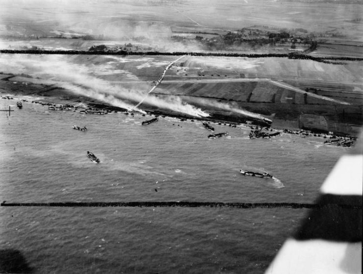 Oblique aerial photo of the junction of King Red and King Green beaches, Gold assault area, during the landing of 50th Infantry Division, 6 June 1944.