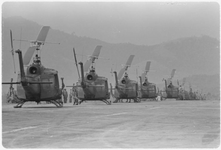 Helicopters of the 170th and the 189th Helicopter Assault Companies await the loading of troops at Polei Kleng, in the Central Highlands of the Republic of South Vietnam, 1969.