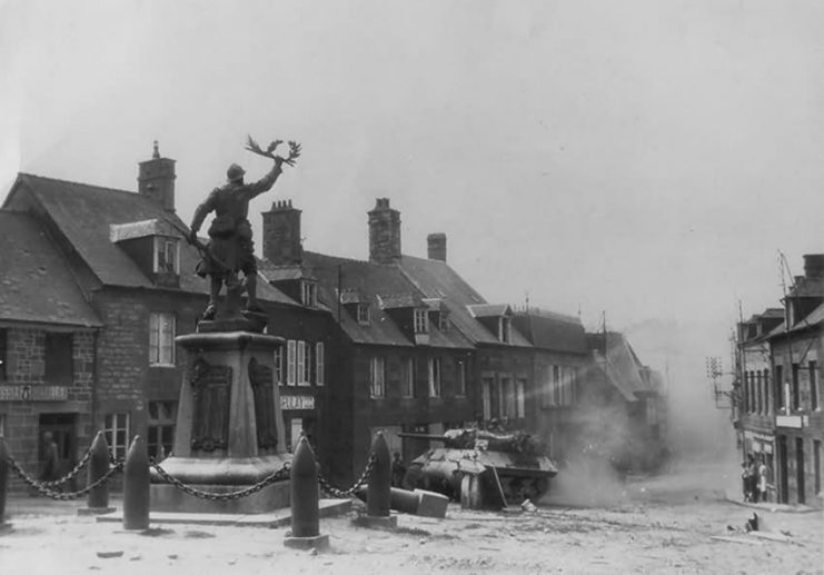 Tank Destroyer passes WWI Memorial in Lonlay-l’Abbaye, 1944