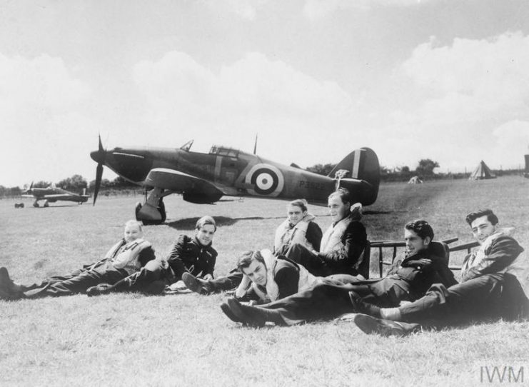 Pilots of ‘B’ Flight, No 32 Squadron in front of Hawker Hurricanes at Hawkinge © IWM (HU 54418)