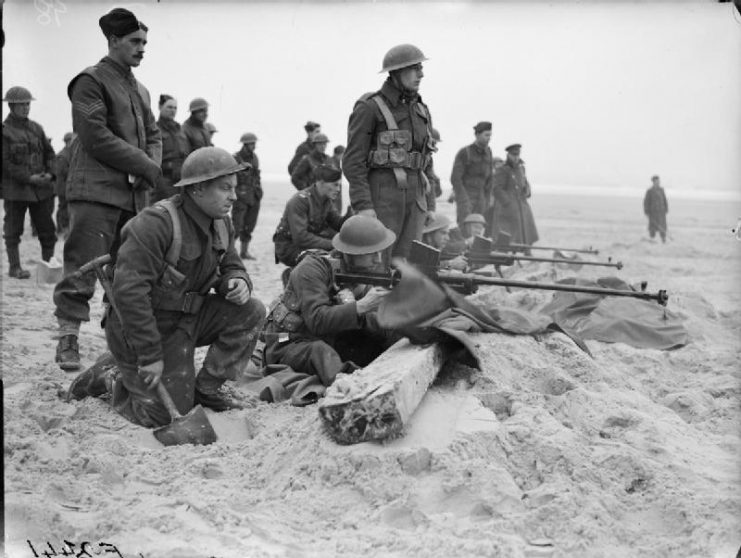 Men of the 1st Royal Welsh Fusiliers practice firing their Boys anti-tank rifles on the beach near Etaples, 6 February 1940.