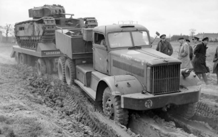 Churchill Mk II on heavy tank transporter M19. M20 Diamond T Model 980 truck and 12-wheel M9 trailer.