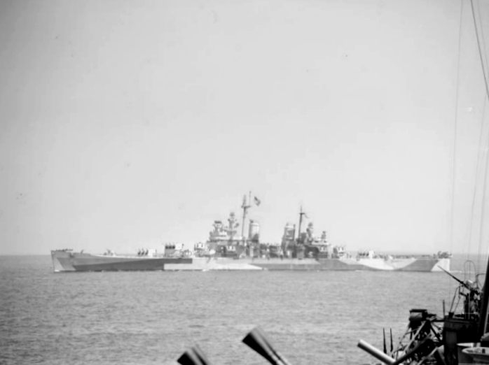 The U.S. Navy heavy cruiser USS Quincy during the bombardment of Cherbourg, 1944.