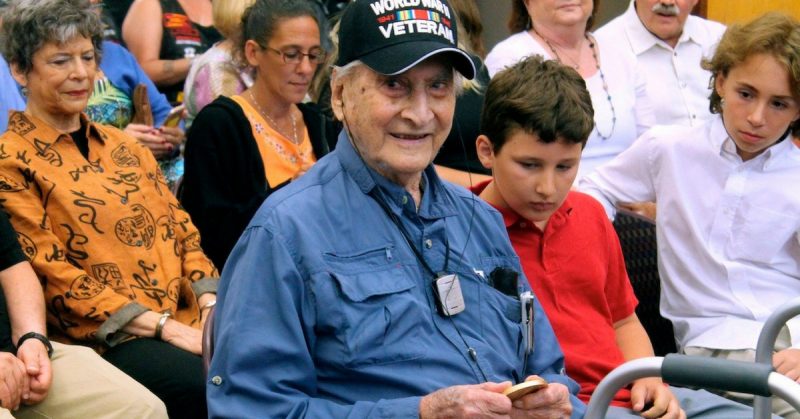 Retired Army Capt. Martin Gelb, 98, holds his Congressional Gold Medal given to him Monday, June 25, 2018, in Derry, New Hampshire. Gelb was honored for his World War II service with the Office of Strategic Services, the precursor to the Central Intelligence Agency. (AP Photo/Holly Ramer)