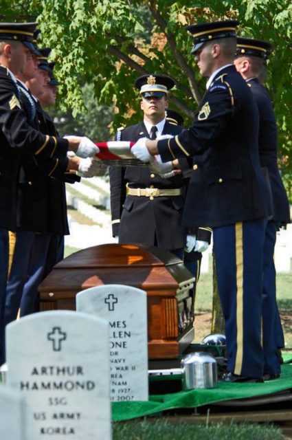 Army Color Guard members fold a flag from the casket of 2nd Lt. Harold E. Hoskin during a burial ceremony Sept. 7 at Arlington National Cemetery in Virginia. Lieutenant Hoskin was one of five men who were flying in a B-24 Liberator that crashed while on a test flight Dec. 21, 1943, out of Ladd Field in Fairbanks, Alaska. Lieutenant Hoskin’s remains were discovered in August 2006 and identified in April 2007. (U.S. Air Force photo/Tech. Sgt. Cohen A. Young)