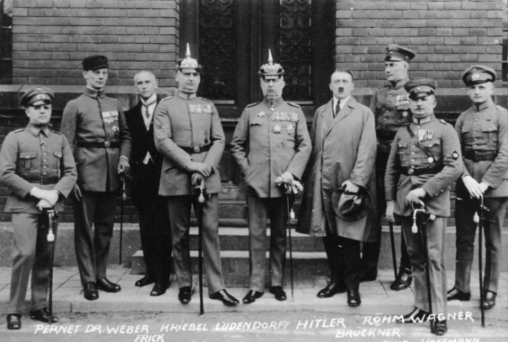 Defendants in the Beer Hall Putsch trial. From left to right: Pernet, Weber, Frick, Kiebel, Ludendorff, Hitler, Bruckner, Röhm, and Wagner.Photo: Bundesarchiv, Bild 102-00344A / Heinrich Hoffmann / CC-BY-SA 3.0