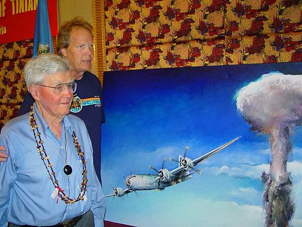 Paul Tibbets (left), pilot of the B-29 bomber Enola Gay, and University of Maine at Presque Isle Prof. Anderson Giles on Tinian in August 2005 during official ceremonies for Giles’ commissioned painting of the B-29 bomber Bockscar leaving Nagasaki with the atomic mushroom cloud behind (photo H. Anderson Giles)