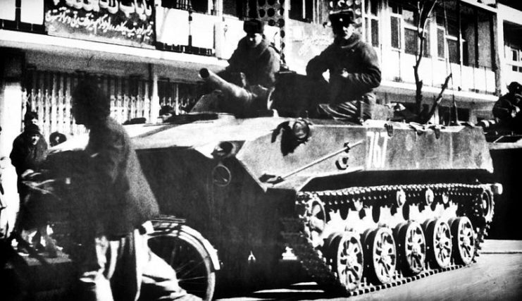 Soldiers ride aboard a Soviet BMD airborne combat vehicle.