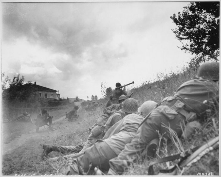 African-American combat patrol advanced three miles north of Lucca (furthermost point occupied by American troops) to contact an enemy machine gun nest. Here a bazooka-man cuts loose at the target some 300 yards distant, 1944