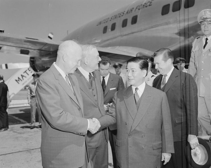 U.S. President Dwight D. Eisenhower and Secretary of State John Foster Dulles greet President Ngô Đình Diệm of South Vietnam in Washington, 8 May 1957.