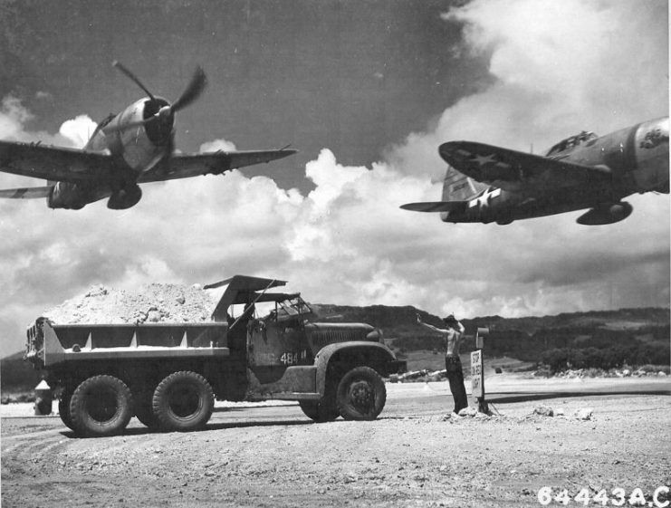 P-47 Thunderbolts from the 318th Fighter Group taking off from East Field on Saipan, Marianas Islands in October 1944.