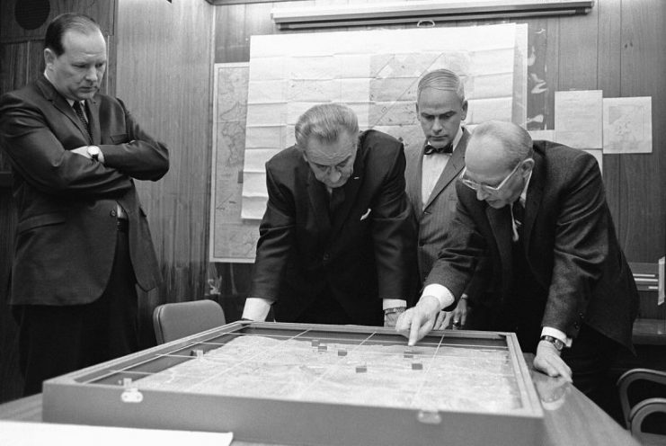 Walt Whitman Rostow shows President Lyndon B. Johnson a model of the Khe Sanh area in Vietnam in February 1968