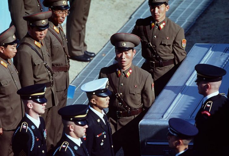 United Nations Command (UNC) honor guard members receive remains from Korean People’s Army soldiers at the Joint Security Area Nov 6,1998