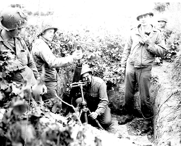 In September 1943, members of the 504th Parachute Infantry Regiment prepare to fire an 81mm mortar during the battle for Italy.