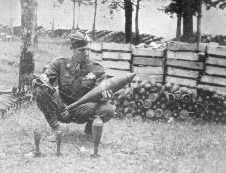 Jim Martin At German Weapons Cache In Austria (April, 1945). Photo by Jim “Pee Wee” Martin – G Company / 3rd Battalion / 506th PIR / 101st Airborne Division 1942-1945. By Brevort / CC BY 2.0