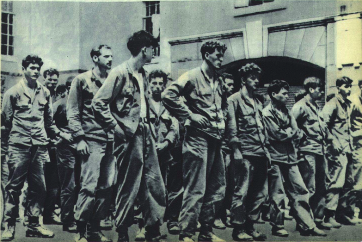 First American soldiers captured in Korean War standing outside of City Hall of Seoul, 8-9 July, 1950