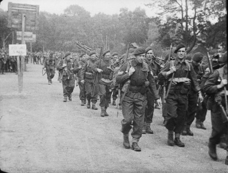 A film still showing men of No. 4 Commando, 1st Special Service Brigade, marching from their assembly camp to Southampton for embarkation to Normandy, June 1944.