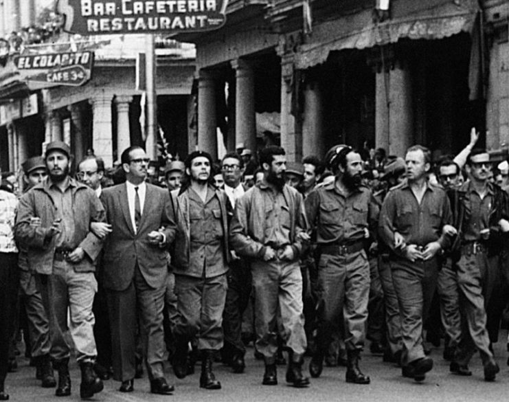 Fidel Castro (far left) and Che Guevara (centre) lead a memorial march in Havana on 5 May 1960, for the victims of the La Coubre freight ship explosion.