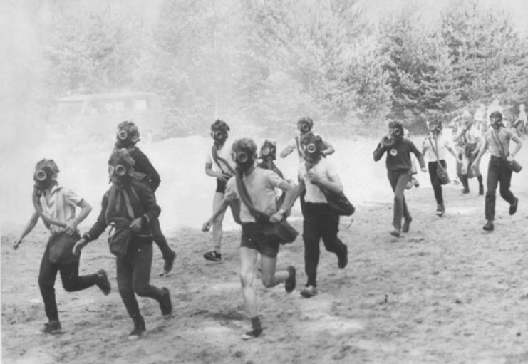 Children running through the “contaminated zone” of the playing field.