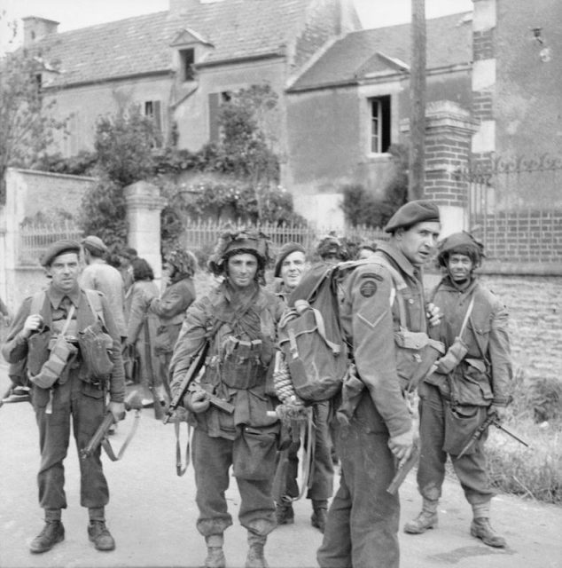 Commandos of No. 4 Commando, 1st Special Service Brigade, and troops of 6th Airborne Division in Bénouville after the link-up between the two forces, 6 June 1944.
