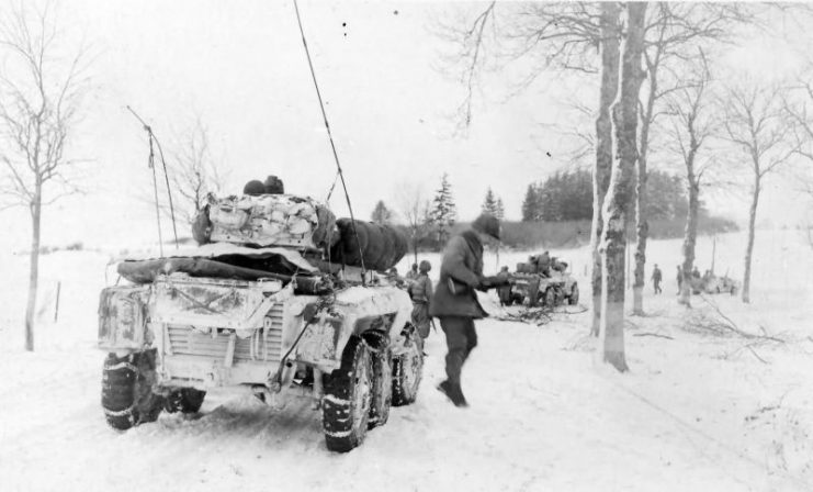 GI’s dismount M8 Armored car and jeeps Mechelau Luxembourg 3rd Army 1945.