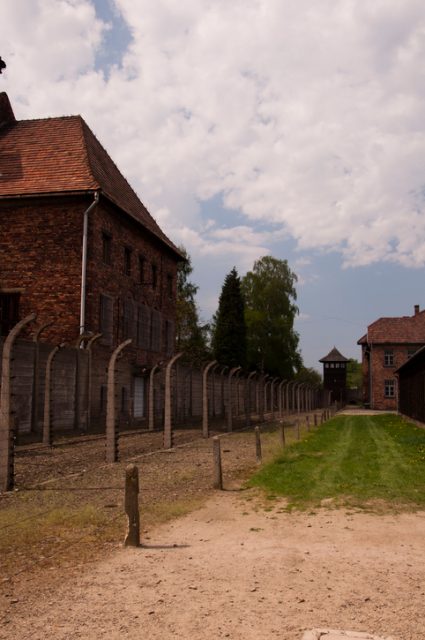 Buildings and barbed wire fence in the Nazi concentration camp in Auschwitz.