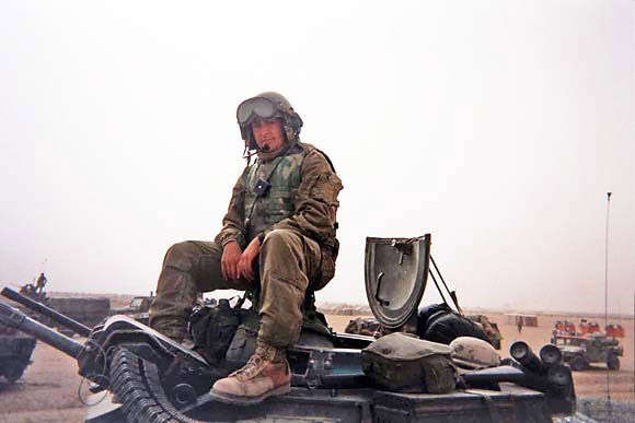 Justin LeHew sitting atop a P781-RAM/RS Amphibious Assault Vehicle (AAV)