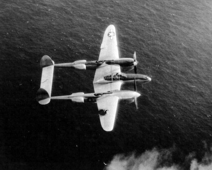 Lt Fred Eberle – January 1945 in his P-38 named “Ripper”. Notice the damage to the wing.