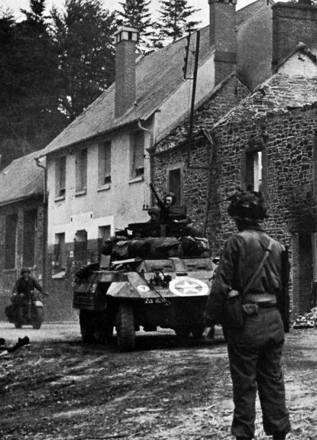 M8 of the 82nd Armored Reconnaissance Battalion, 2nd Armored Division at St. Lo, 1944.