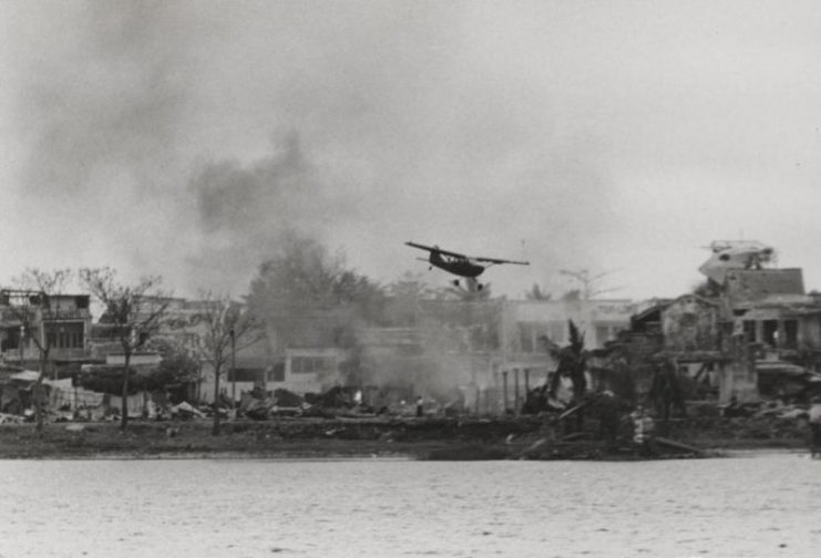 A U.S. Marines O-1 flies past the Citadel