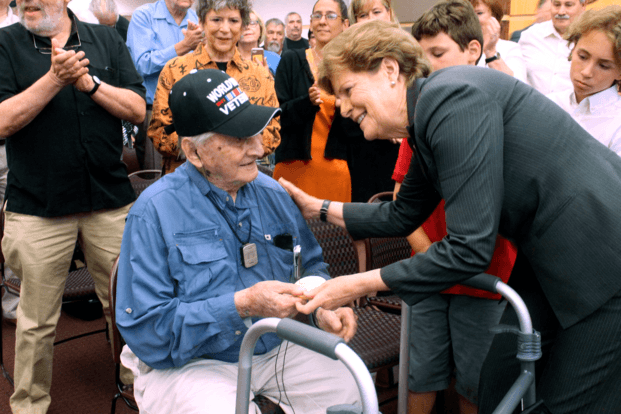 Retired Army Capt. Martin Gelb is presented with the Congressional Gold Medal by U.S. Sen. Jeanne Shaheen, D-N.H., on Monday, June 25, 2018, in Derry, New Hampshire. (AP Photo/Holly Ramer)