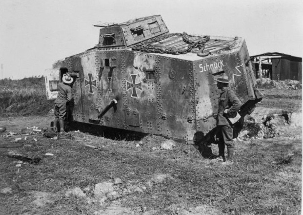 New Zealand soldiers examining a German tank nicknamed “Schnuck”, captured by New Zealand forces on the Western Front. Photograph taken 8 September 1918 by Henry Armytage Sanders