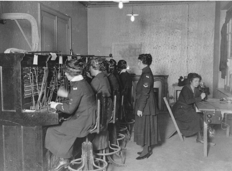 Signal Corps telephone operators at switchboard. Left to right: Rose Langelier; Melanie Van Gastel; Louisette Gavid; Marie Lemaire; Eglantine Moussu. Toul, Meurthe et Moselle, France.