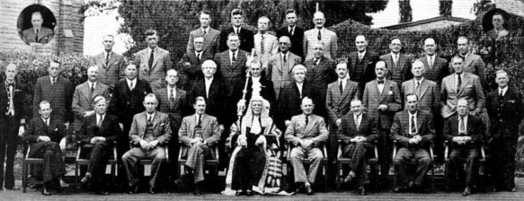 The seventh Southern Rhodesian Legislative Assembly, the first to feature Smith, in 1948. Smith is the left-most figure in the back row.