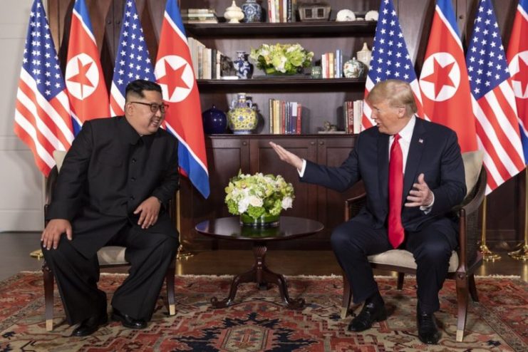 Donald Trump and Kim Jong-un talking in Capella Hotel, during the Singapore summit