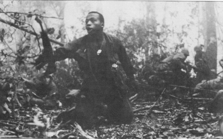 U.S. Soldier (believed to be Mahlon S. Jenkins) calls for a medic during the Battle of Dak To 1967.