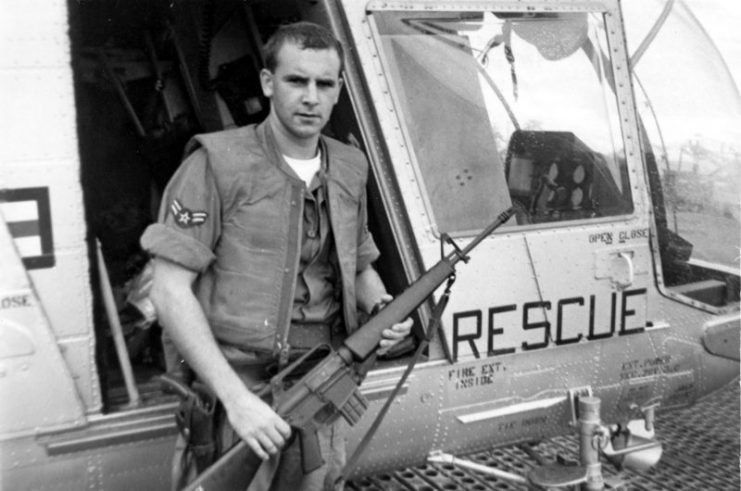 A1C William Pitsenbarger with an M16 outside the HH-43.