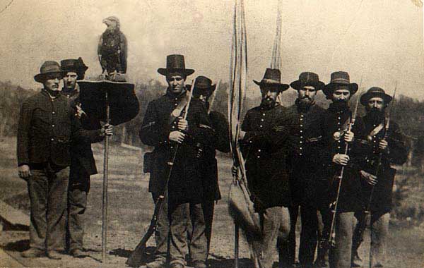 The Wisconsin 8th Volunteer Infantry Eagle Regiment with Old Abe at Vicksburg in July 1863. Eagle-bearer Edward Homaston is probably holding the perch. Sgt Ambrose Armitage is third from left.