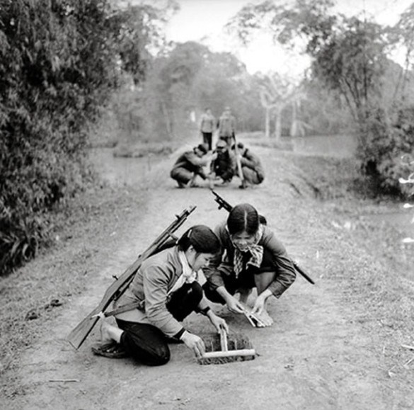Young North Vietnamese Militiawomen learn how to set booby traps.