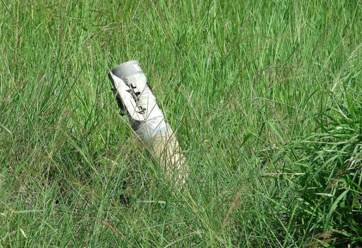 An unexploded 122mm projectile of multiple rocket launcher of BM-21 Grad stuck into muddy land in Vaharai of Batticaloa, Sri Lanka during the civil war. Photo: AntanO / CC-BY-SA 4.0