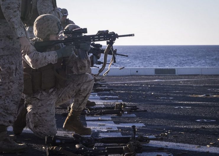 Marines from the 31st Marine Expeditionary Unit conduct a live-fire exercise with M27 Infantry automatic rifles on the flight deck of the amphibious transport dock ship USS Green Bay (LPD 20).